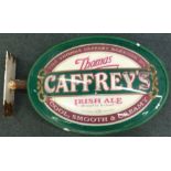 An old pub mounted Caffrey's sign.