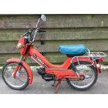 TOMOS: A motorbike in red. Registration: D829 NTA.