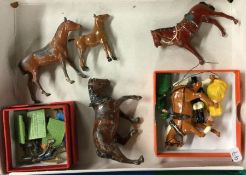 A mixed lot of painted lead figures and horses.