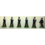 A boxed set of six lead policeman figures.