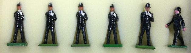 A boxed set of six lead policeman figures.