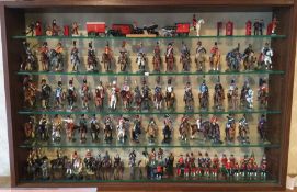 A large display cabinet with lead figures on horseback.