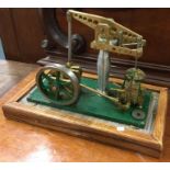A cast iron and brass mounted stationary steam engine.