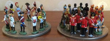 Two sets of miniature figures.