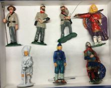 A group of painted lead figures.