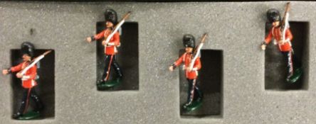A boxed set of four painted soldiers.