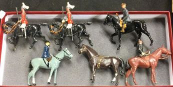A group of six lead figures of horses.