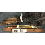 An old spirit level, drainage rods etc.