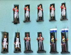 A group of eleven painted lead figures in Army dress.