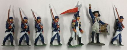 A group of seven painted lead figures.