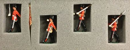 A boxed set of four painted soldiers.