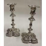 A fine pair of silver candlesticks with shell design. Sheffield 1961. By James Dixon & Sons.