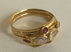 A small Continental 18 carat gold ruby and diamond mounted ring.