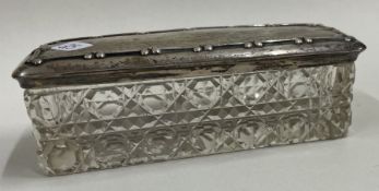 A rectangular glass jar with embossed silver lid. Birmingham 1909.