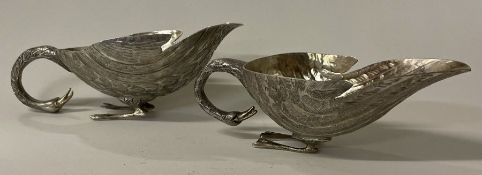 A novelty pair of silver sauceboats in the form of ducks.
