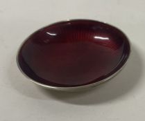 A Norwegian silver and red enamelled counter dish.