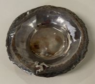 A contemporary silver hammered bowl. London 1981.