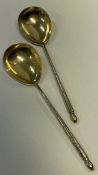A pair of very fine silver gilt plated spoons. By Elkington & Co.