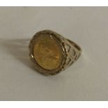 A 1/10 ounce of a Krugerrand mounted as a ring in 9 carat mount.