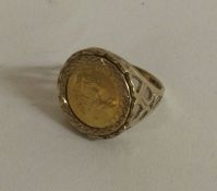 A 1/10 ounce of a Krugerrand mounted as a ring in 9 carat mount.