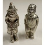 A novelty pair of boy and girl Victorian silver peppers.
