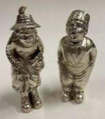 A novelty pair of boy and girl Victorian silver peppers.