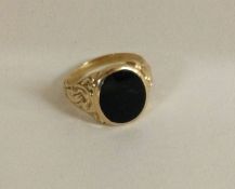 A good gold mounted signet ring inset with onyx.