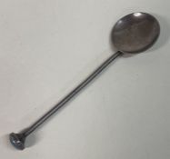 A small silver spoon with stone top. By Bernard Instone.