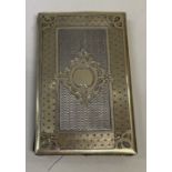 An engine turned silver gilt travelling card case.