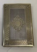 An engine turned silver gilt travelling card case.