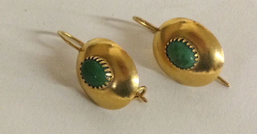 A good pair of turquoise and 14 carat gold earrings.