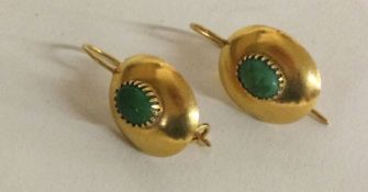 A good pair of turquoise and 14 carat gold earrings.