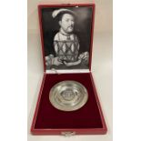 A limited edition cased silver armada dish embossed with an image of King Henry VIII.