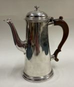 A rare 18th Century silver crested coffee pot. London 1735.