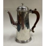 A rare 18th Century silver crested coffee pot. London 1735.