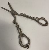 A fine pair of George III silver grape scissors with shell design. London 1808.