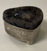 LUEN WO: A Chinese silver hammered pin cushion in the shape of a heart.
