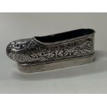 A Chinese silver model of a shoe. Marked to base.