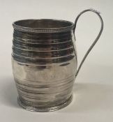 An 18th Century George III silver christening mug of barrelled form. London 1778.