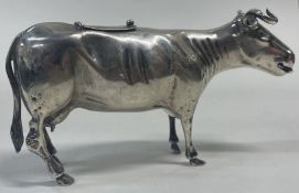 An early 19th Century silver cow creamer.