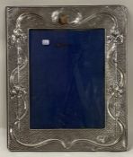 An Arts and Crafts decorative Edwardian chased silver photo frame. Birmingham 1902.