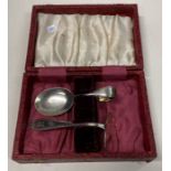 A cased silver pusher and spoon.