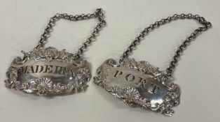 A fine cast pair of silver wine labels for 'Port' and 'Madeira'. London 1817. By John Reily.