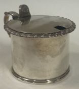 A George III silver and glass hinged mustard pot. London 1826.