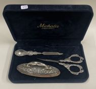 A cased silver mounted three piece manicure set.