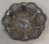 A Victorian silver embossed dish. Birmingham 1899. By BTC.