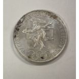 A Mexican silver coin 720 standard.