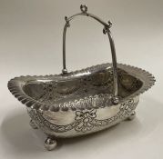 A chased Victorian silver basket embossed with swags. Sheffield 1890. By James Dixon & Sons.