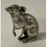 A novelty Victorian silver pepper in the form of mouse. With import marks.