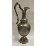 A fine Judaica Victorian floral silver wine jug decoratively displaying cartouches.